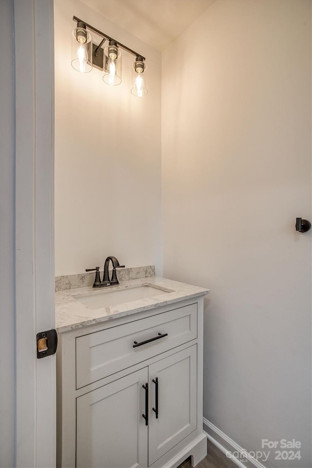 bathroom featuring vanity and hardwood / wood-style floors