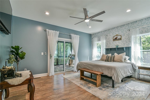 bedroom featuring wood-type flooring, access to exterior, and ceiling fan