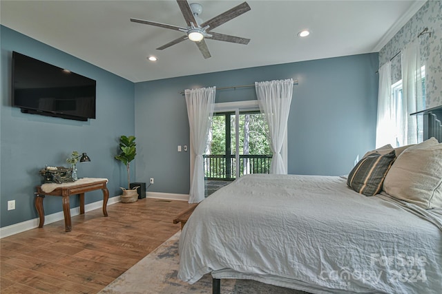 bedroom with access to exterior, ceiling fan, and hardwood / wood-style flooring