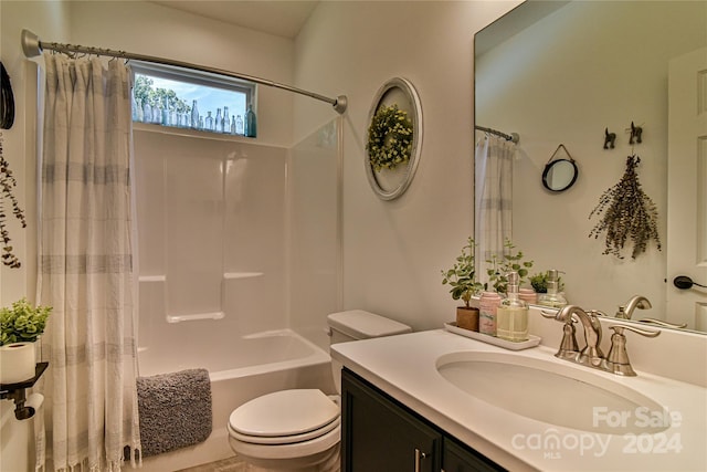 full bathroom featuring toilet, shower / tub combo, and vanity