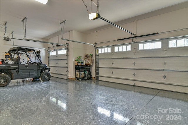 garage featuring a garage door opener