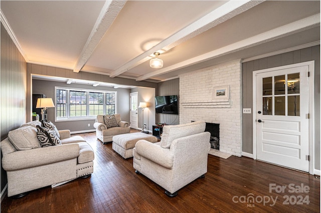 living room with a brick fireplace, beamed ceiling, crown molding, and dark hardwood / wood-style flooring