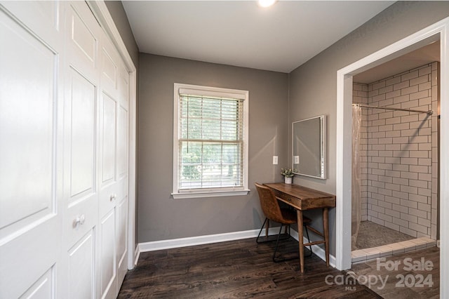 bathroom with hardwood / wood-style flooring and a shower with curtain