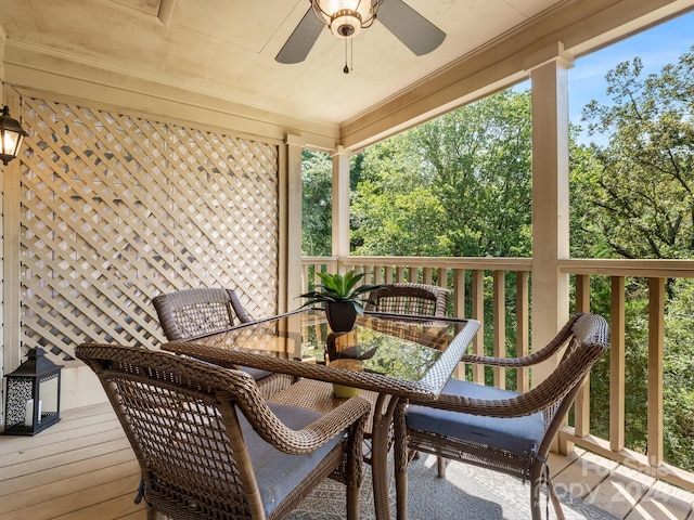 wooden deck featuring ceiling fan