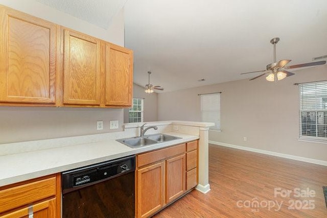 kitchen with sink, light hardwood / wood-style flooring, kitchen peninsula, dishwasher, and ceiling fan