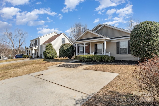 view of front of house with covered porch and a front yard