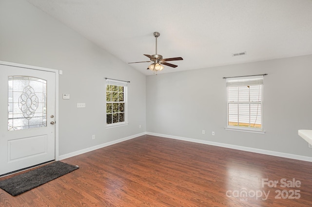 foyer featuring plenty of natural light, dark hardwood / wood-style floors, ceiling fan, and vaulted ceiling