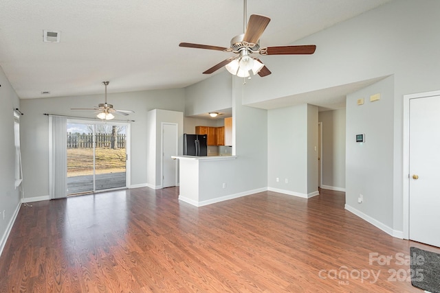 unfurnished living room with hardwood / wood-style flooring, ceiling fan, and vaulted ceiling