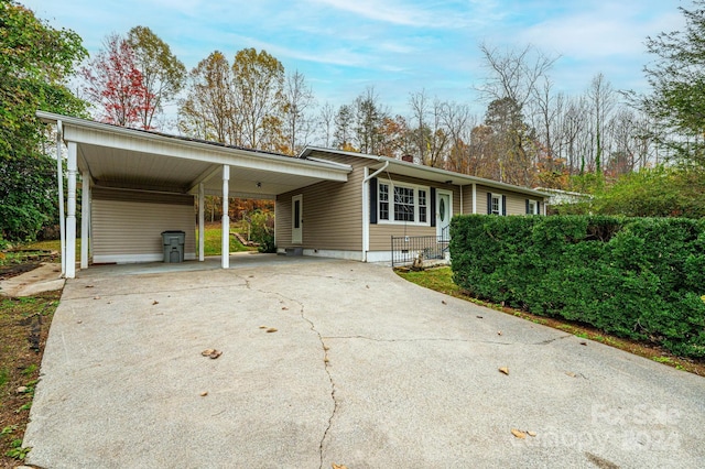 single story home featuring a carport