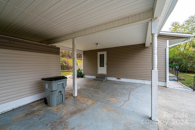 view of patio featuring a carport