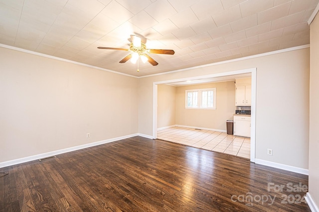 unfurnished room featuring light hardwood / wood-style flooring and crown molding