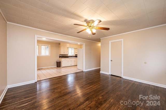 unfurnished living room with ornamental molding, sink, and light hardwood / wood-style flooring