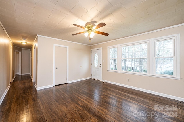 unfurnished room featuring crown molding and dark wood-type flooring