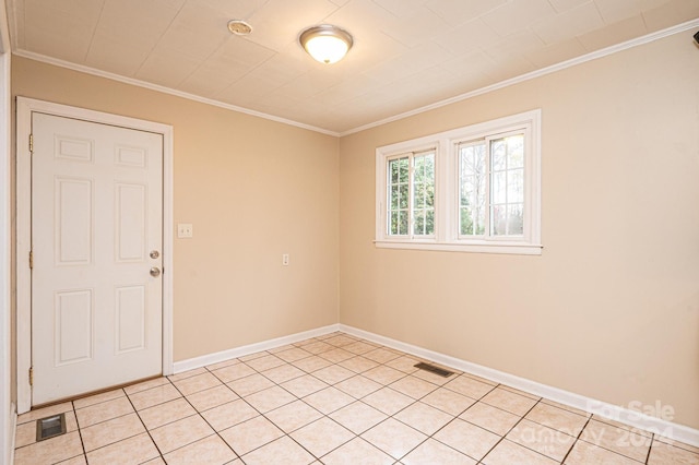 unfurnished room with light tile patterned flooring and ornamental molding