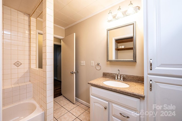 bathroom featuring tiled shower / bath combo, vanity, tile patterned floors, and crown molding