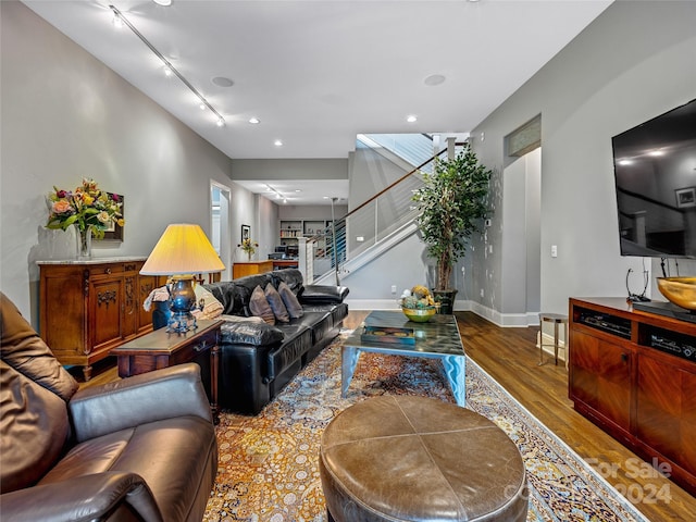 22 Foxbridge Way, Arden, NC 28704 - living area with wood finished floors, stairway, and baseboards