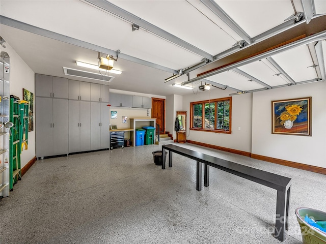 22 Foxbridge Way, Arden, NC 28704 - garage with a garage door opener and baseboards