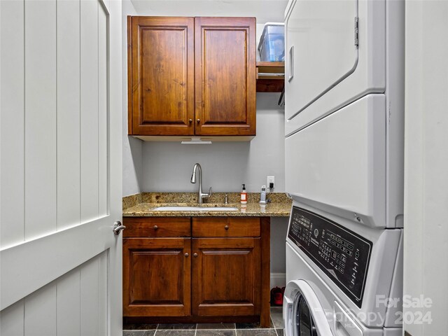 22 Foxbridge Way, Arden, NC 28704 - washroom featuring stacked washer / dryer and cabinet space