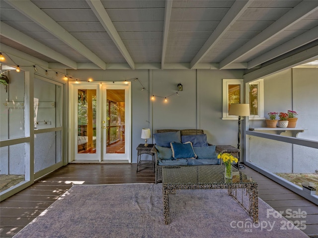 unfurnished sunroom with french doors and beamed ceiling