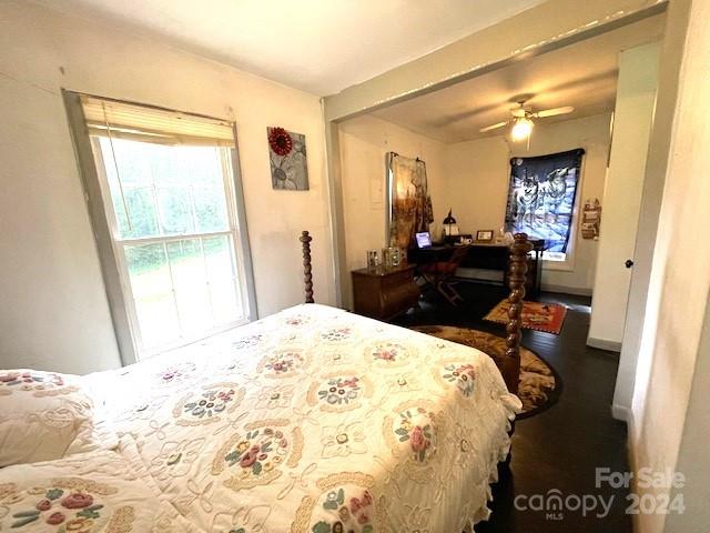 bedroom with multiple windows and ceiling fan