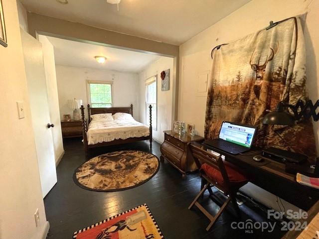 bedroom with hardwood / wood-style floors