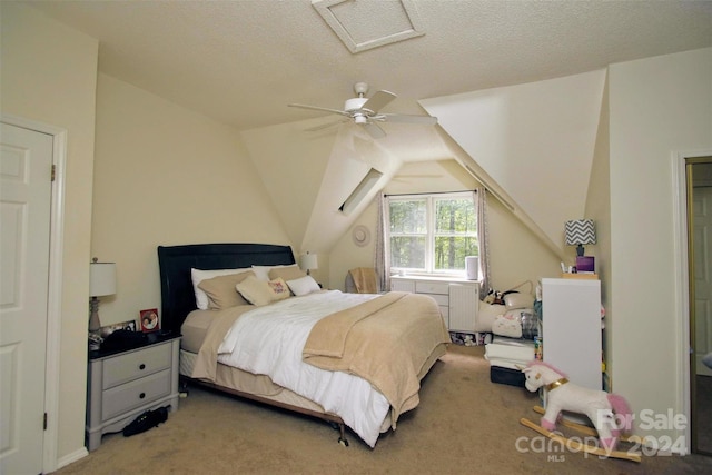 bedroom featuring lofted ceiling, radiator, ceiling fan, a textured ceiling, and carpet floors