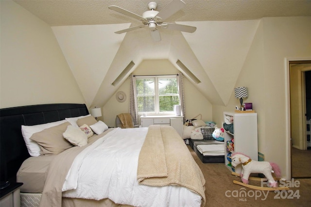 carpeted bedroom with a textured ceiling, ceiling fan, and lofted ceiling