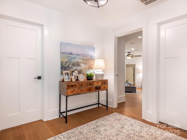 corridor featuring hardwood / wood-style flooring