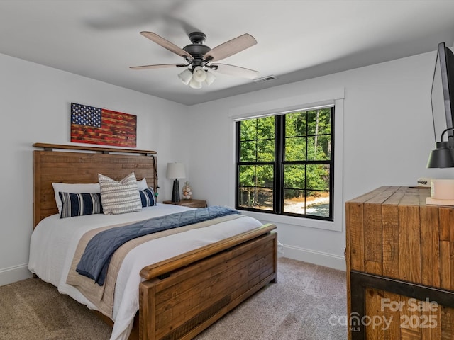 bedroom with ceiling fan and carpet flooring