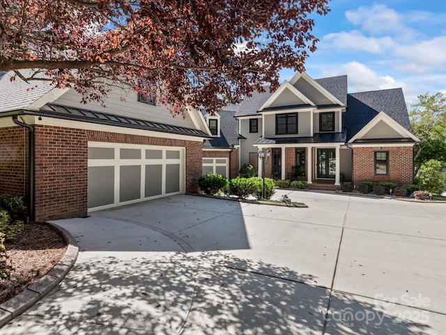 view of front of property with a garage