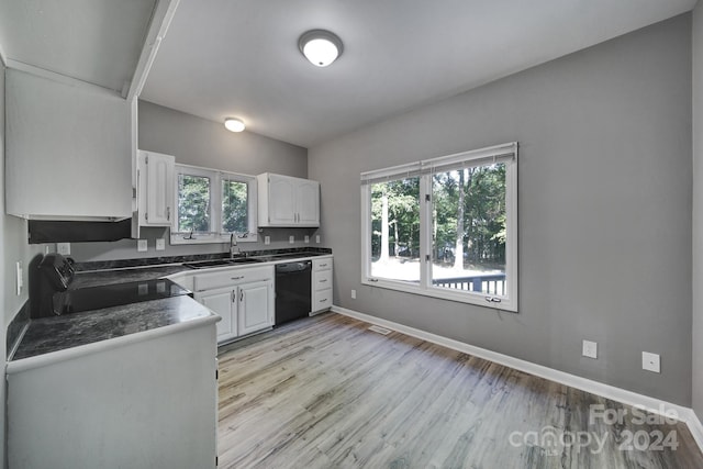 kitchen with light hardwood / wood-style flooring, white cabinets, black appliances, and sink