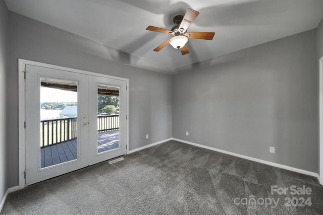 carpeted empty room featuring ceiling fan and french doors