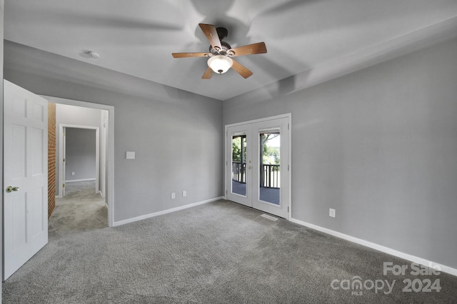 carpeted empty room featuring ceiling fan and french doors