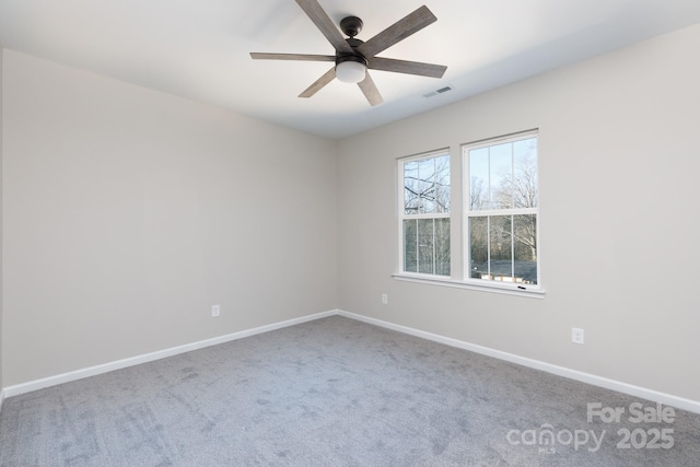 carpeted empty room with ceiling fan