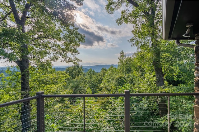 exterior space featuring a wooded view