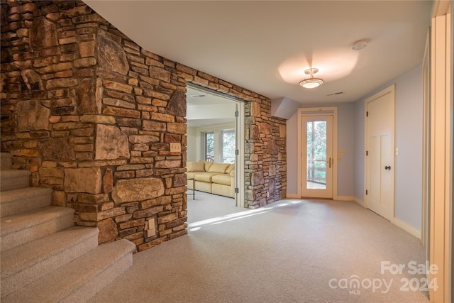 view of carpeted foyer