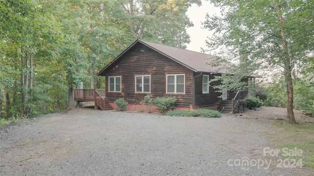 exterior space featuring stairway and a deck