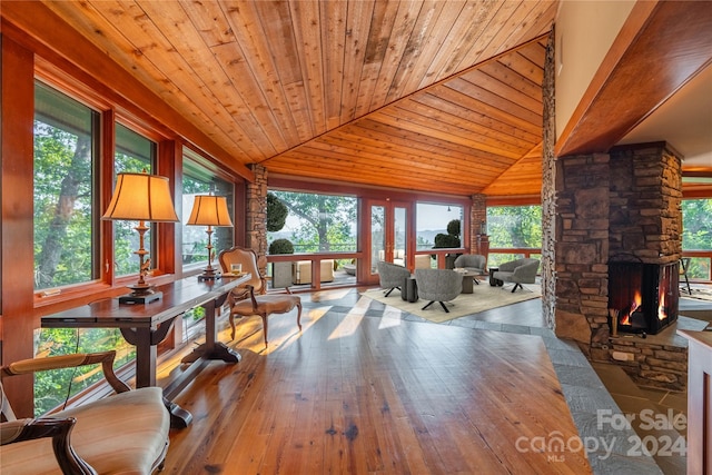 interior space featuring a fireplace, hardwood / wood-style floors, and plenty of natural light
