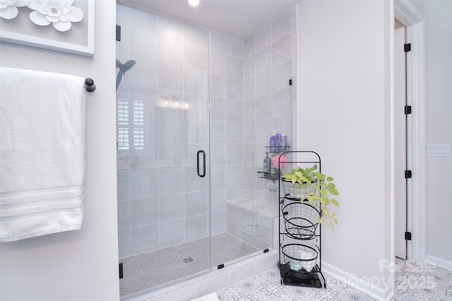 bathroom with tile patterned flooring and an enclosed shower