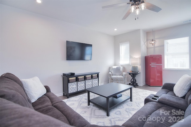 living room featuring ceiling fan