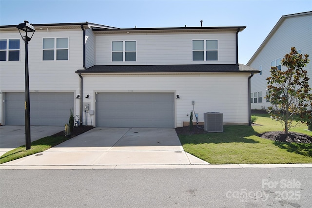 view of front facade with a garage and a front yard