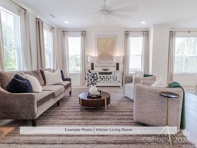 living room with ceiling fan, hardwood / wood-style flooring, and a healthy amount of sunlight