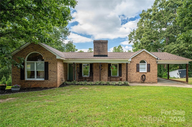 ranch-style house featuring a front lawn, a carport, and a porch