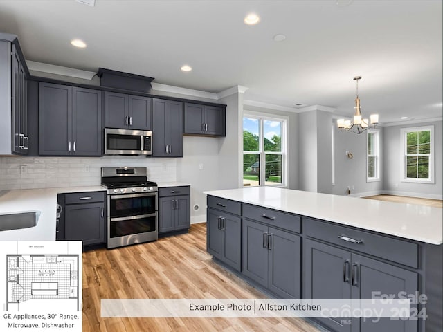 kitchen with tasteful backsplash, decorative light fixtures, light hardwood / wood-style flooring, appliances with stainless steel finishes, and crown molding