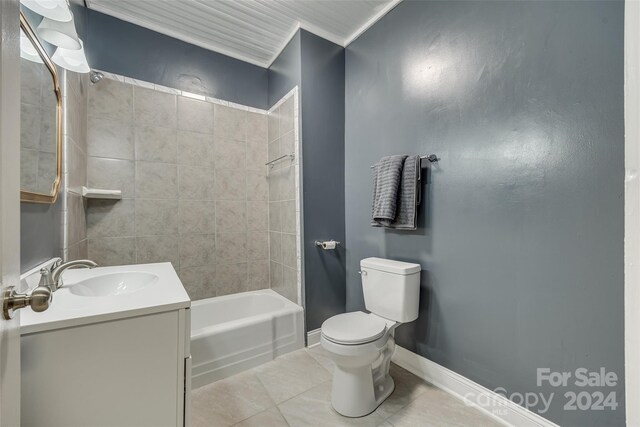 full bathroom with tile patterned flooring, vanity, toilet, and tiled shower / bath combo