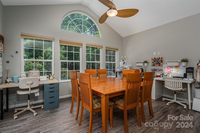 dining room with dark hardwood / wood-style floors, vaulted ceiling, ceiling fan, and a healthy amount of sunlight