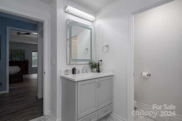 bathroom featuring vanity and ceiling fan