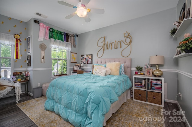 bedroom with hardwood / wood-style flooring and ceiling fan