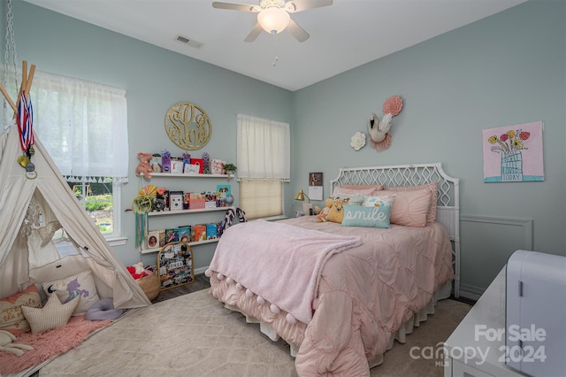 bedroom featuring visible vents and a ceiling fan