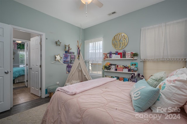 bedroom featuring ceiling fan and hardwood / wood-style floors